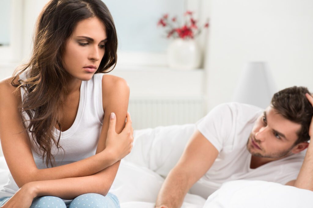 male and female of heterosexual couple in a bedroom